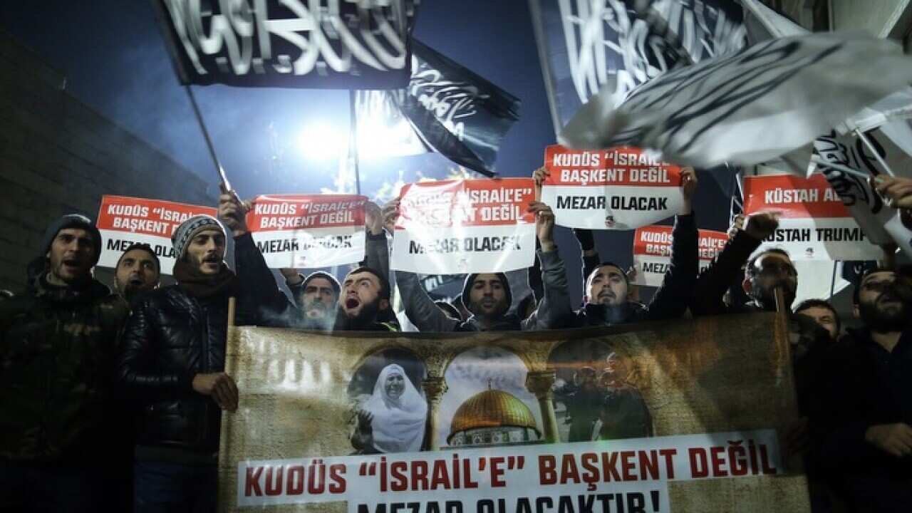 Protestors shout slogans against US President Donald Trump outside the US Consulate in Istanbul, Turkey.