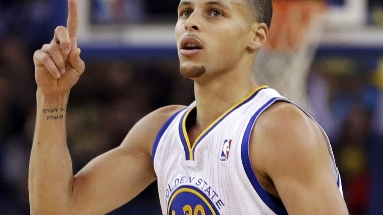 Golden State Warriors' Stephen Curry celebrates after scoring