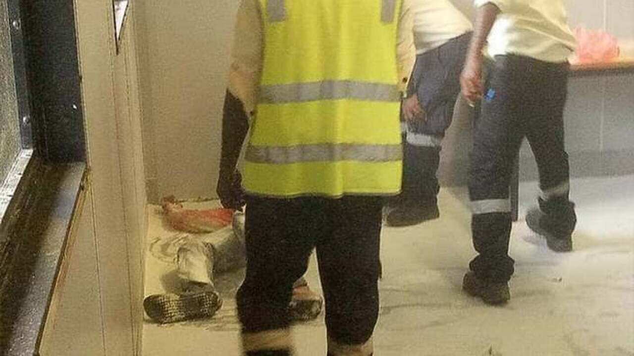 A Somali refugee is tended to by authorities