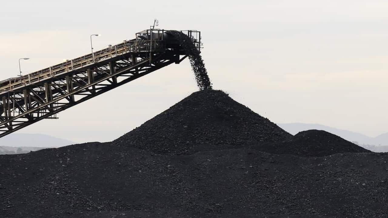 A stock image of coal being stockpiled