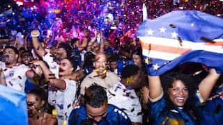 Football fans celebrate.