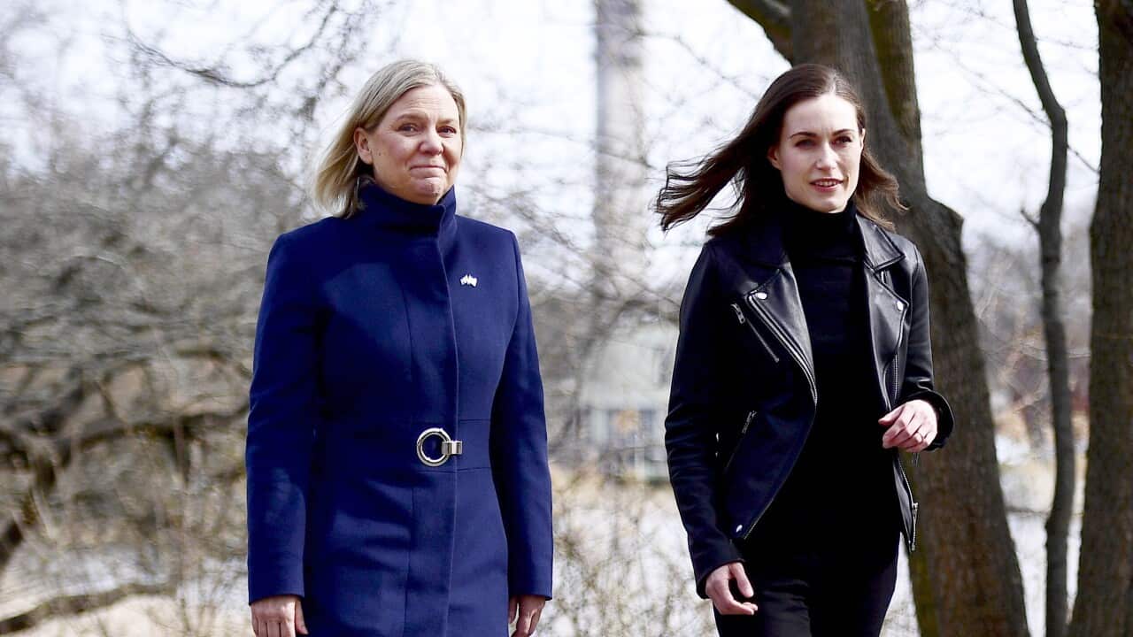 Two women walking outside