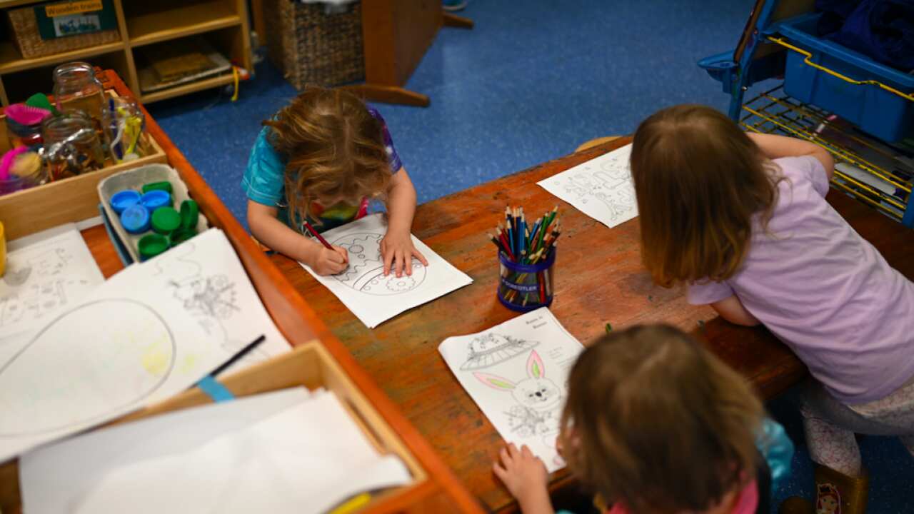 A small group of children play at the Robertson Street Kindy Childcare Centre in Helensburgh south of Sydney, Friday, April 3, 2020