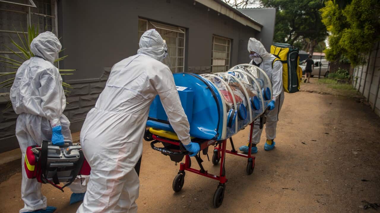Members of the Tshwane Special Infectious Unit wearing personal protective equipment pick up a suspected COVID-19 patient on 15 January, 2021.