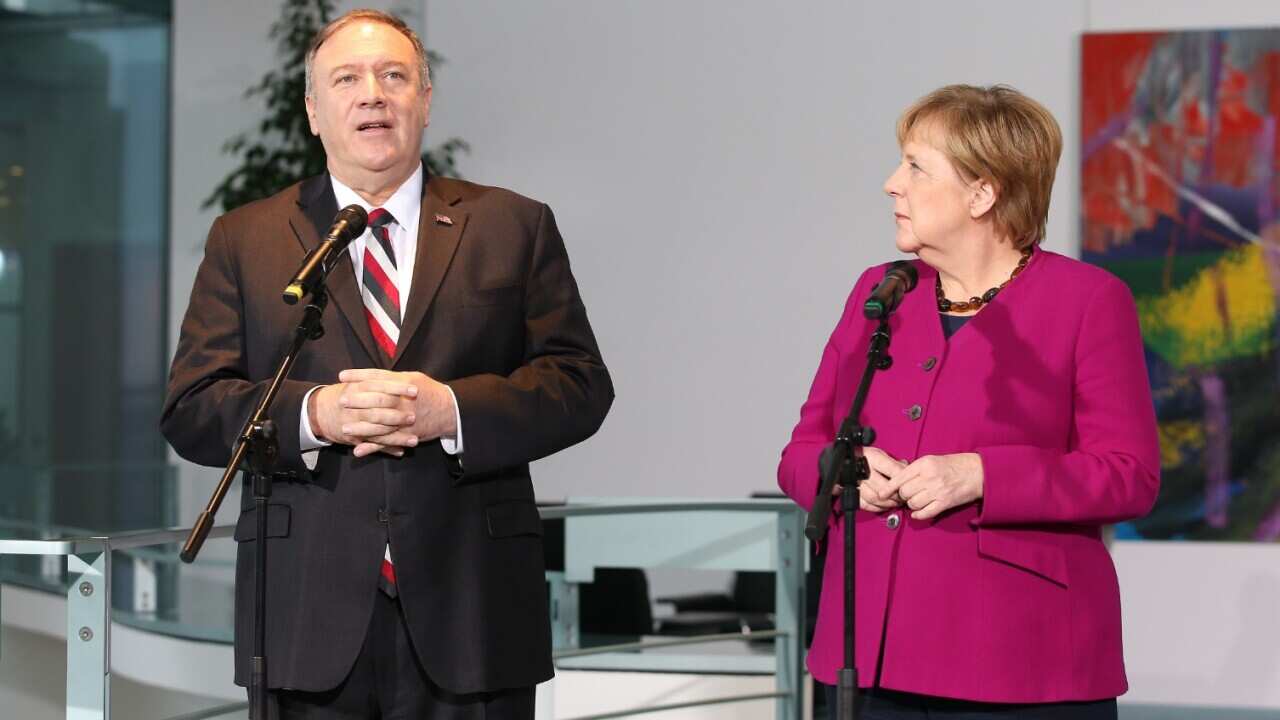  German chancellor Angela Merkel (L) and U.S. Secretary of State Mike Pompeo hold a press statement at the German Chancellery in Berlin
