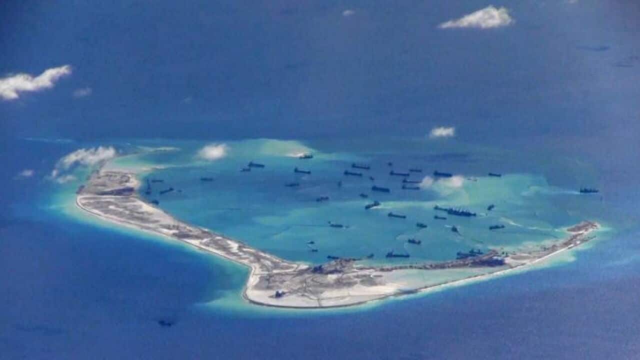 Mischief Reef in the South China Sea, with dredging ships.