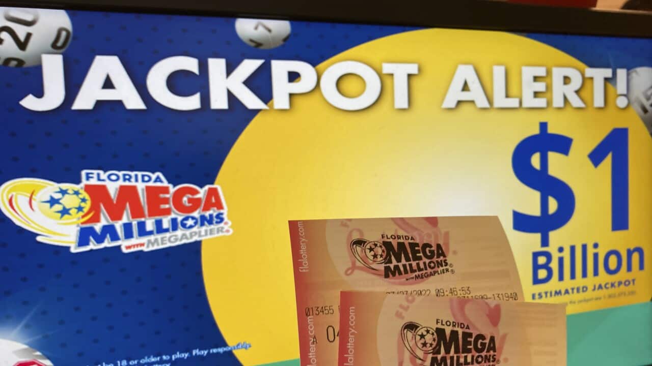 FILE - In this Wednesday, July 27, 2022 file photo, Mega Millions lottery tickets are shown at a lottery retailer in Surfside, Fla. A giant Mega Millions lottery jackpot ballooned to over $1 billion after no one matched all six numbers and won the top pri