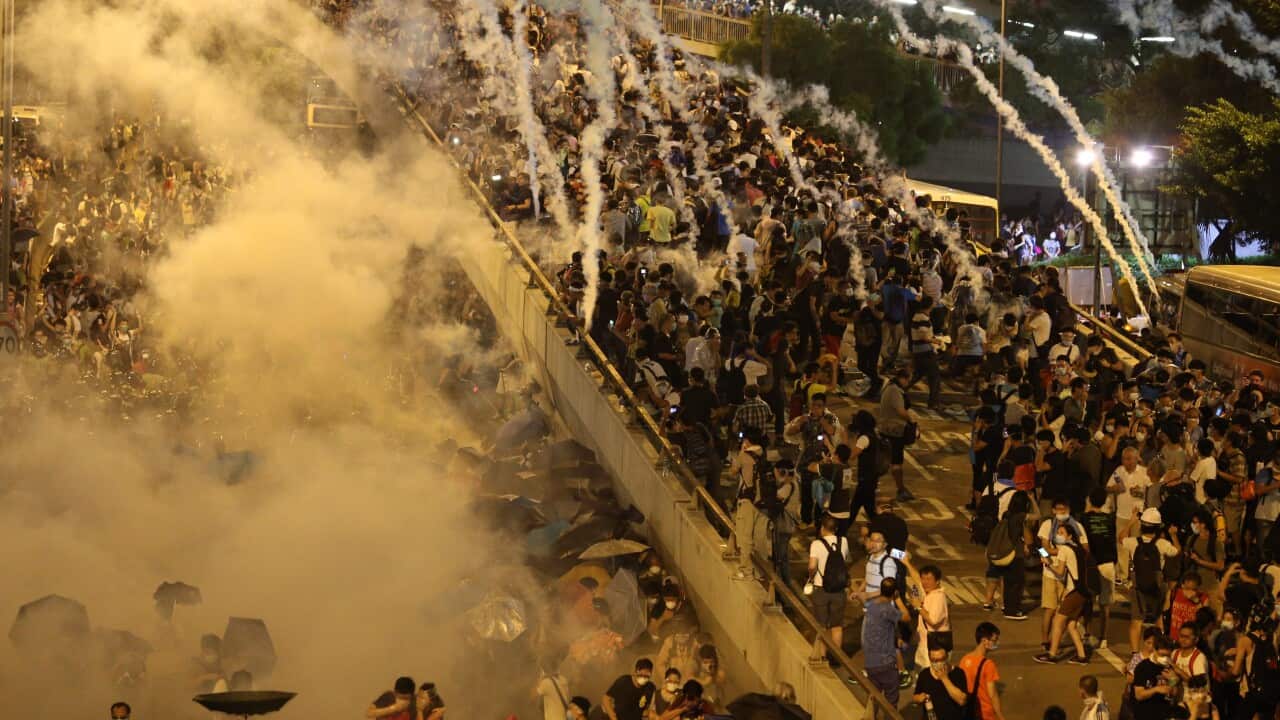 Police fire tear gas upon pro-democracy demonstrators in Hong Kong