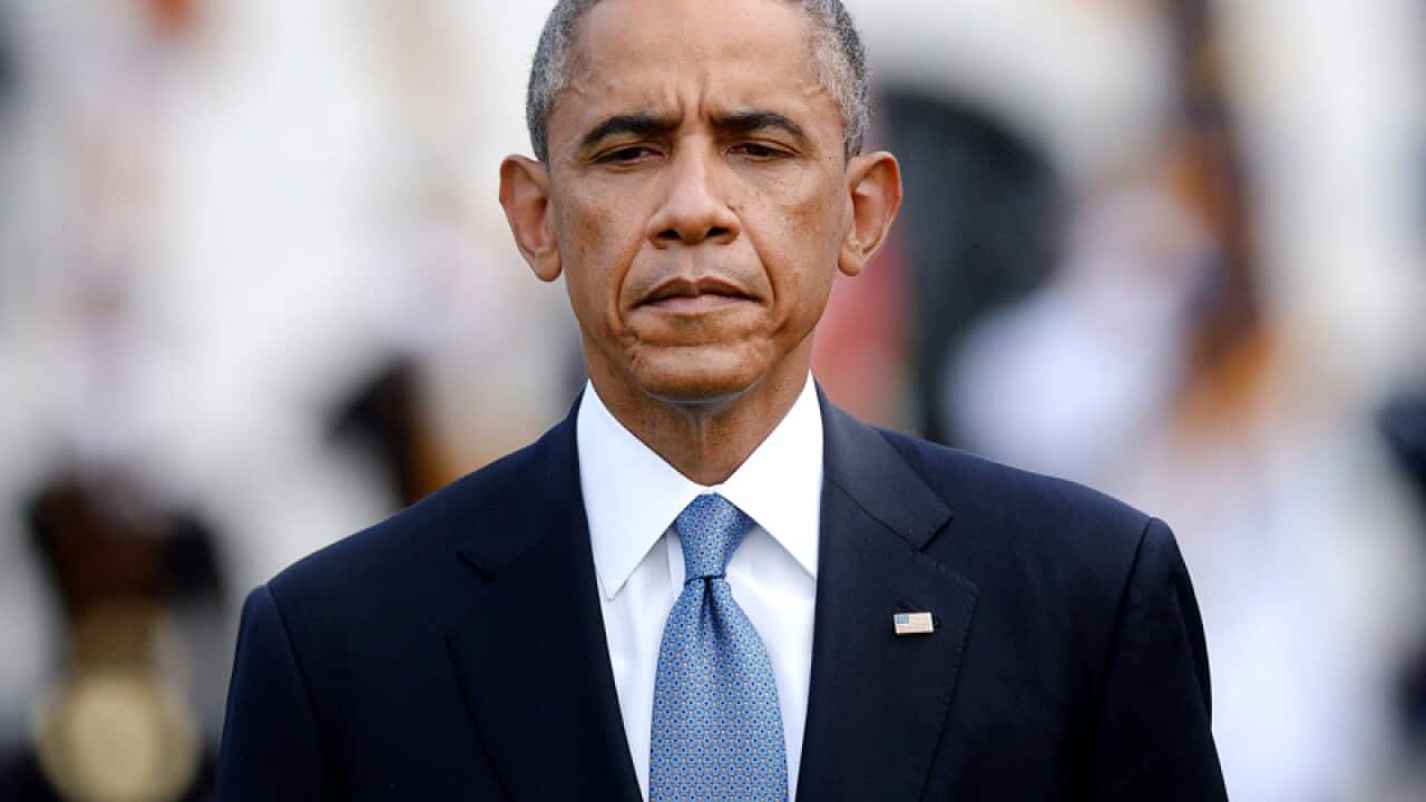 Barack Obama observes a moments silence for the 9/11 anniversary.