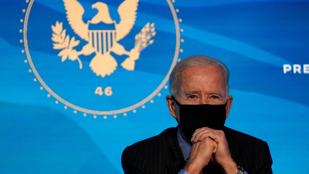 Joe Biden listens during an event at The Queen theater in Wilmington, Del., Friday, Jan. 8, 2021, to announce key administration posts. (AP Photo/Susan Walsh)