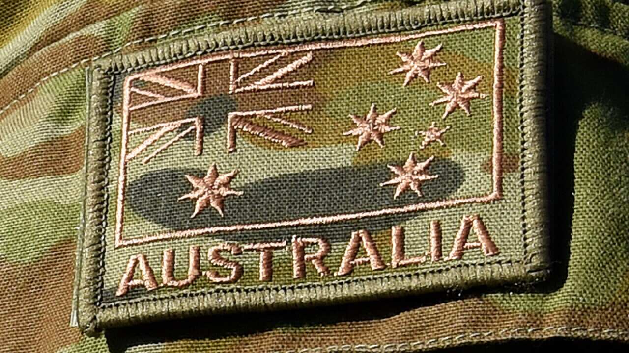 An Australian flag on a defence force uniform