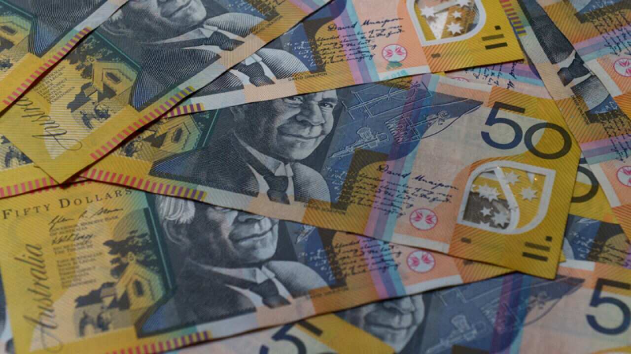 A pile of Australian fifty dollar notes