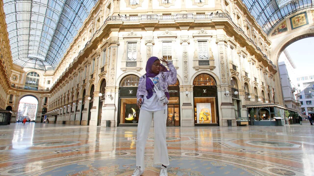 Aida Diouf Mbengue records a video for her TikTok account to share with her 330,000 followers in an empty Vittorio Emanuele gallery, Italy.