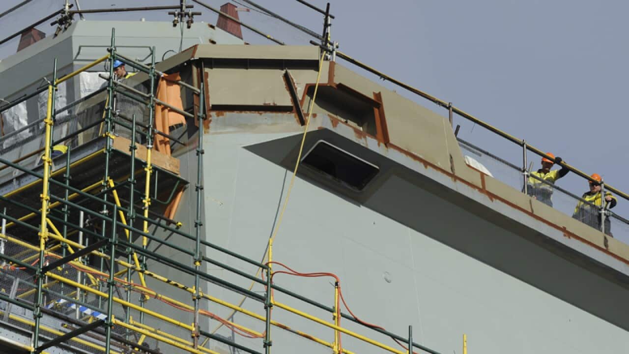 Workers are seen at the ASC warship construction site in Adelaide