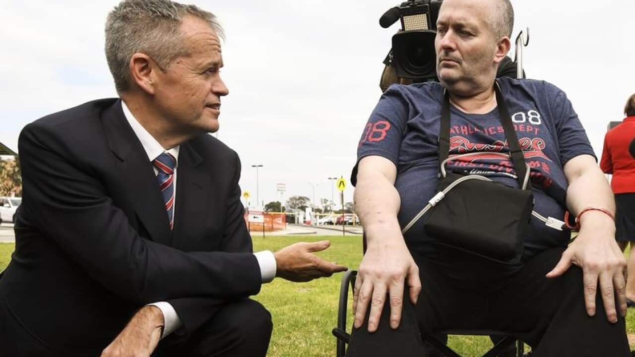 Bill Shorten talks to cancer patient Rob Gibbs outside Casey Hospital.