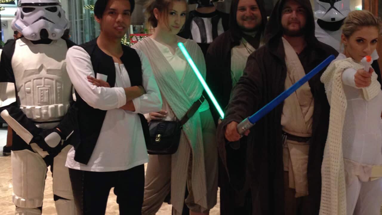 Cosplayers dress up for a midnight screening of Star Wars