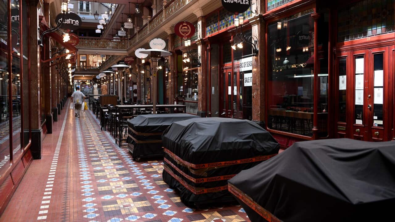 Empty cafe seating areas are seen at the Strand Arcade in Sydney during lockdown.