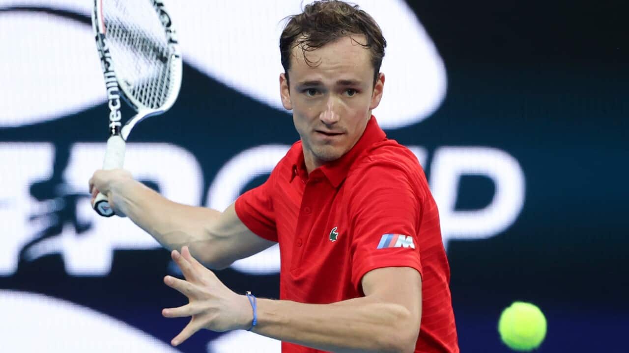 Russia's Daniil Medvedev makes a forehand return to Argentina's Diego Schwartzman during their ATP Cup match in Melbourne, Australia, Tuesday, Feb. 2, 2021.