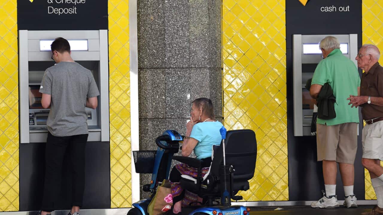 Customers using a Commonwealth Bank ATM