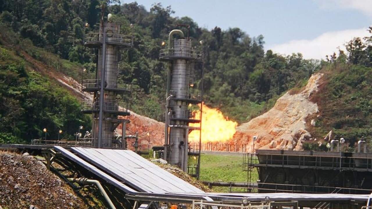Gas flaring behind Oil Search Ltd's Kutubu operations in 2004