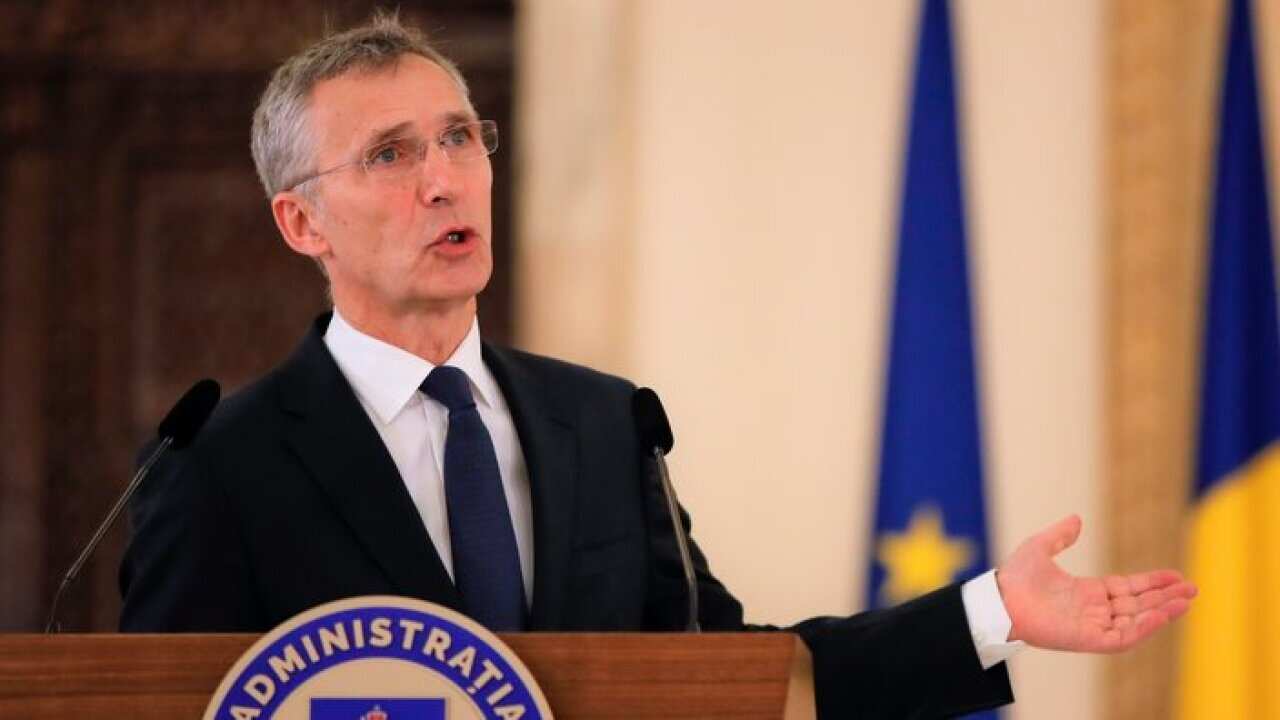 NATO Secretary-General Jens Stoltenberg gestures during a media statement in Bucharest, Romania, Thursday, Jan. 31, 2019. NATO's chief has called on China to treat detained two Canadian citizens "fairly and with due process." (AP Photo/Vadim Ghirda)