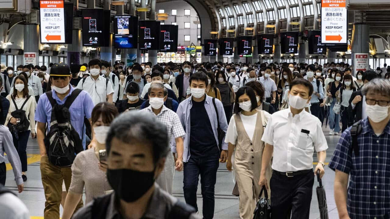 Commuters at Shinagawa station in Tokyo, Japan