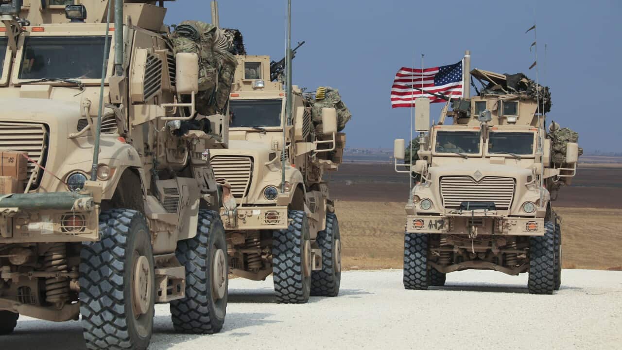 American military convoy stops near the town of Tel Tamr, north Syria.