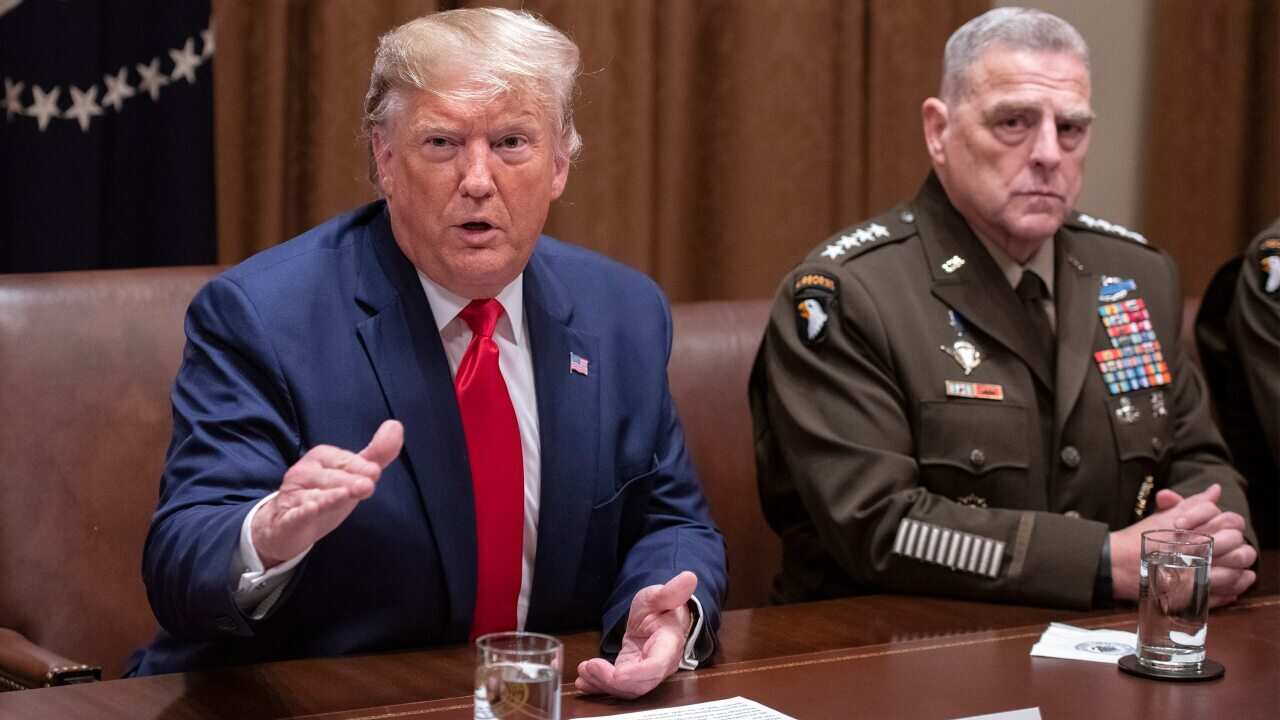US President Donald Trump answers a reporter's question as he participates in a briefing with senior military leaders in the Cabinet Room of the White House