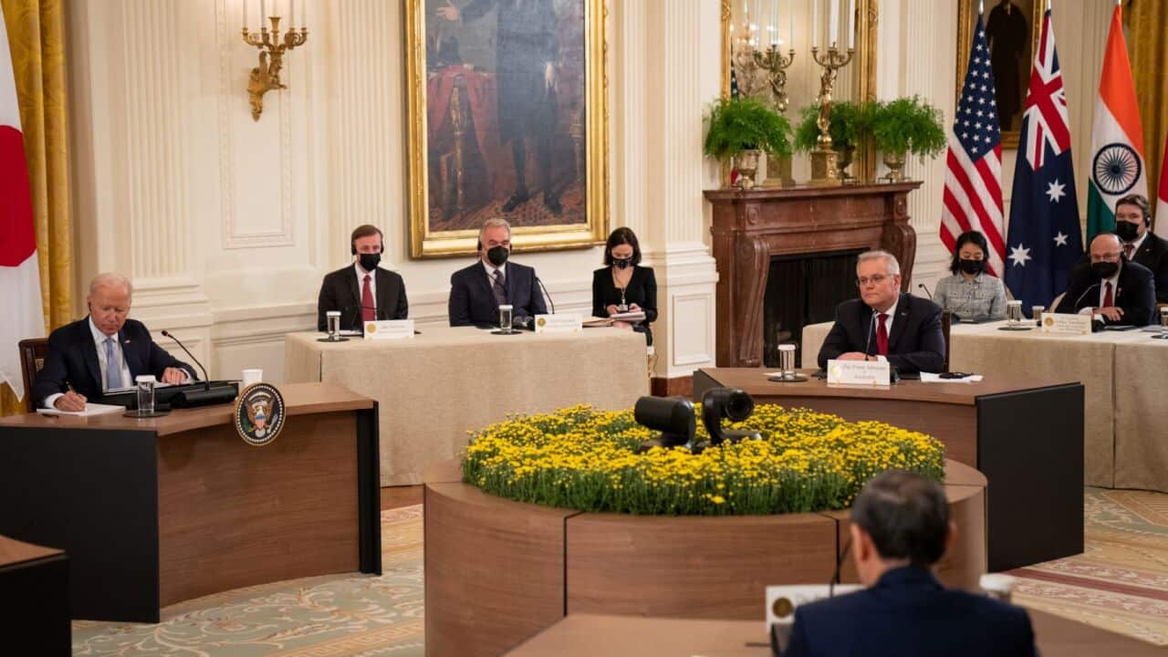 President Joe Biden, left, hosts a Quad Leaders Summit