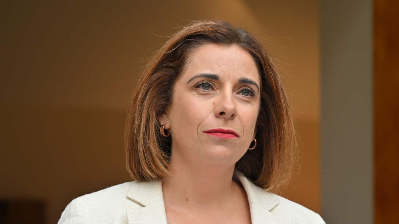 A woman in a white jacket