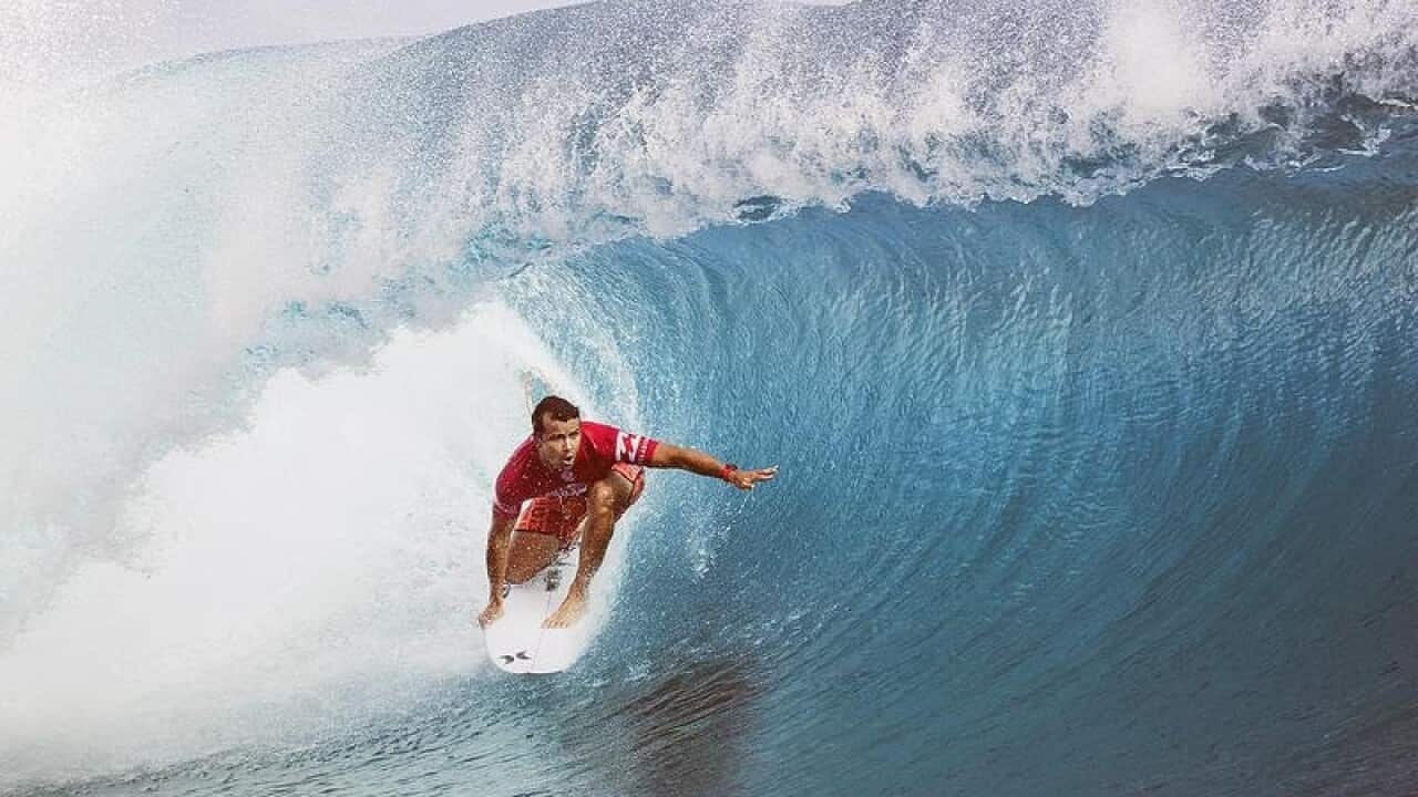 Julian Wilson riding a wave