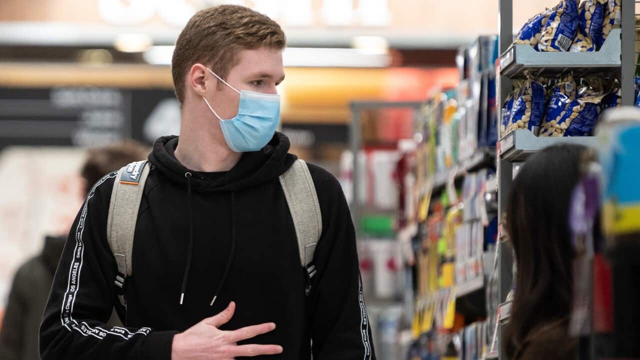 A shopper wearing a face mask inside a Sydney supermarket