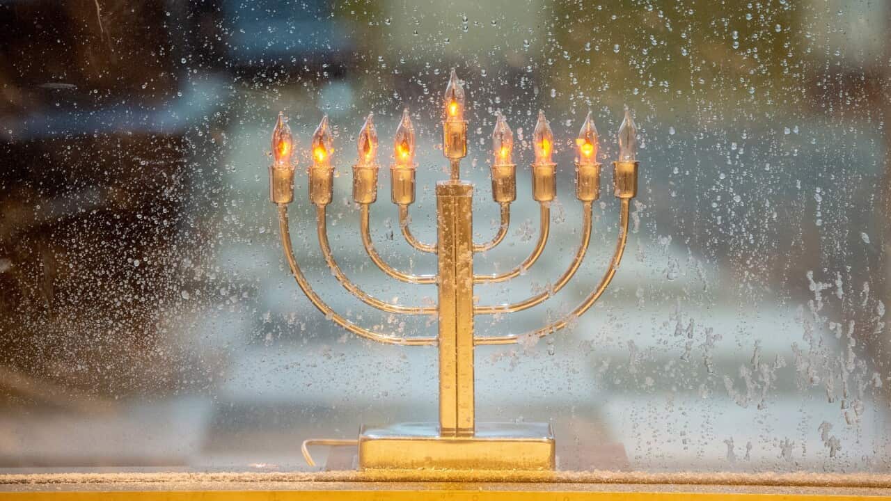 A Hanukkah menorah in a window in New York City