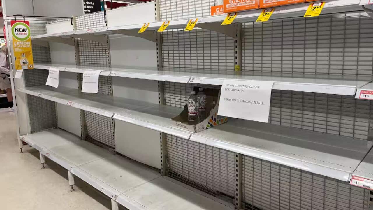 Store shelves were left empty after Darwin residents stocked up on bottled water and other supplies.jpg