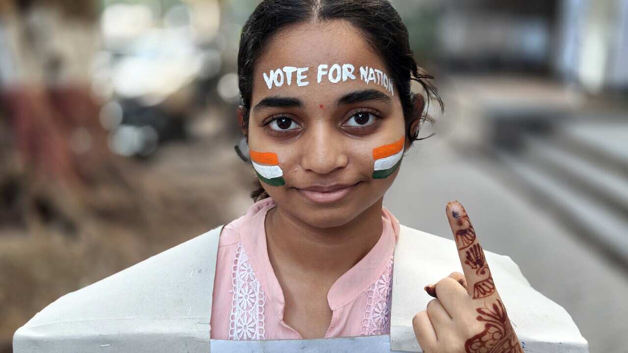 Students from Gurukul school of art paint poster to create awareness about voting during election in Mumbai, India - 04 May 2024