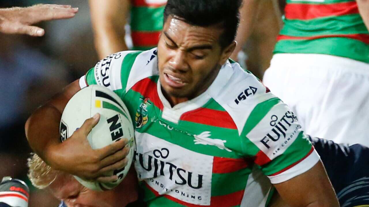 Rabbitohs Hymel Hunt tackled by Cowboys defence