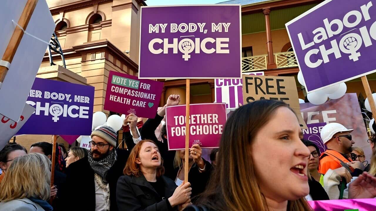 Pro-life and pro-choice advocates protest the bill.