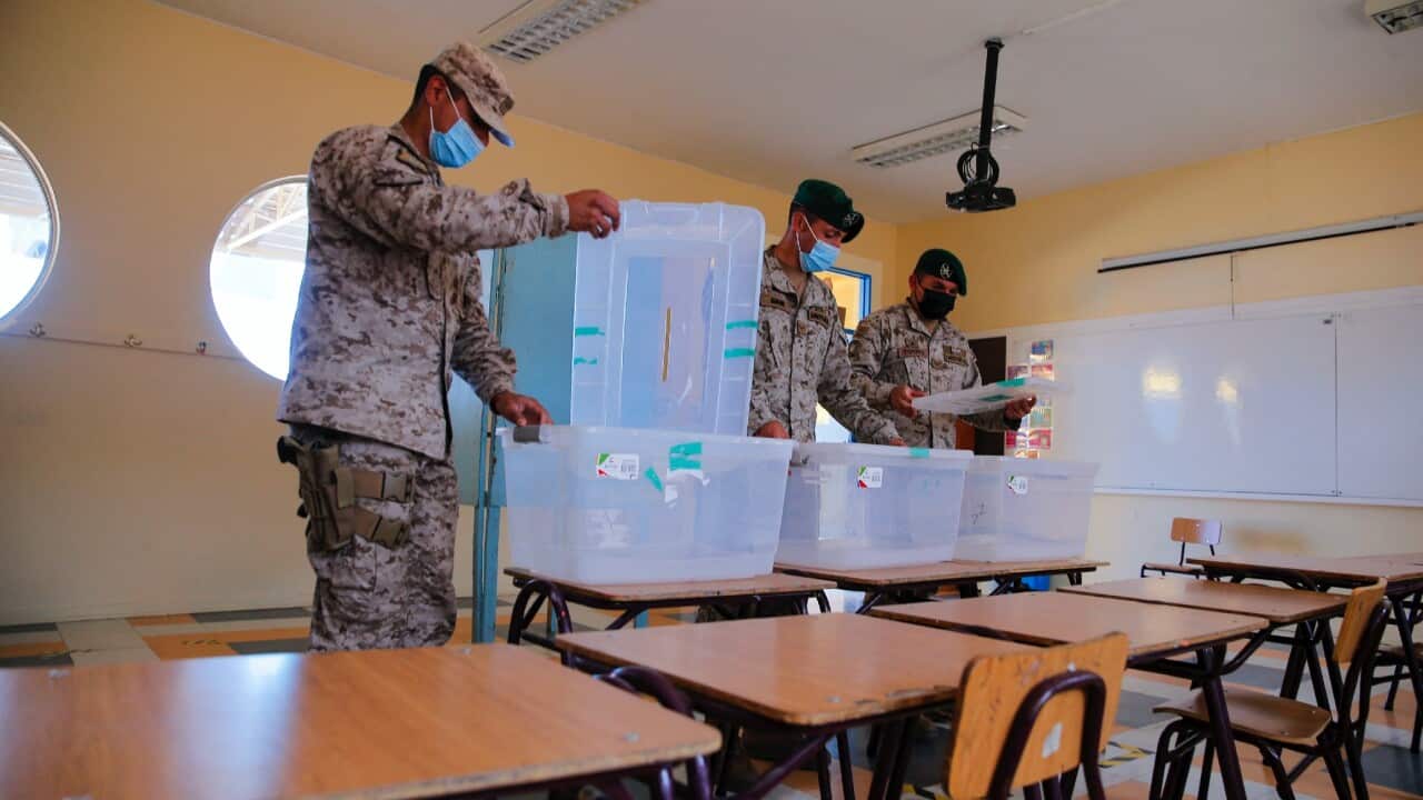 Soldiers help with the logistics at a polling station in the Gualberto Kong Fernandez Basic School in Vallenar, Chile.