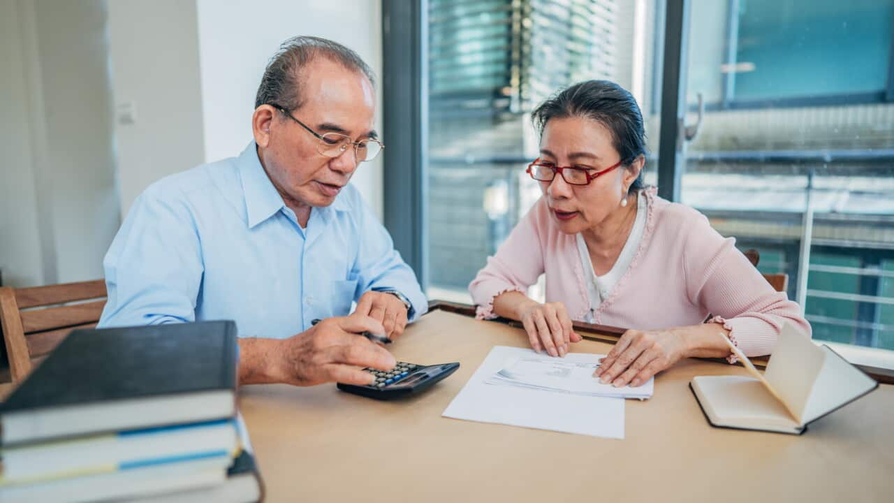 Senior couple doing finances at home