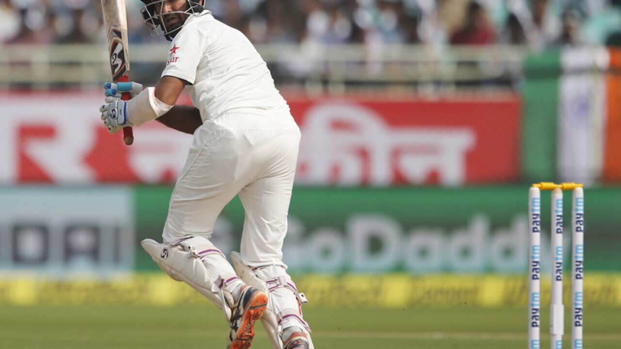 India's Cheteshwar Pujara plays a shot