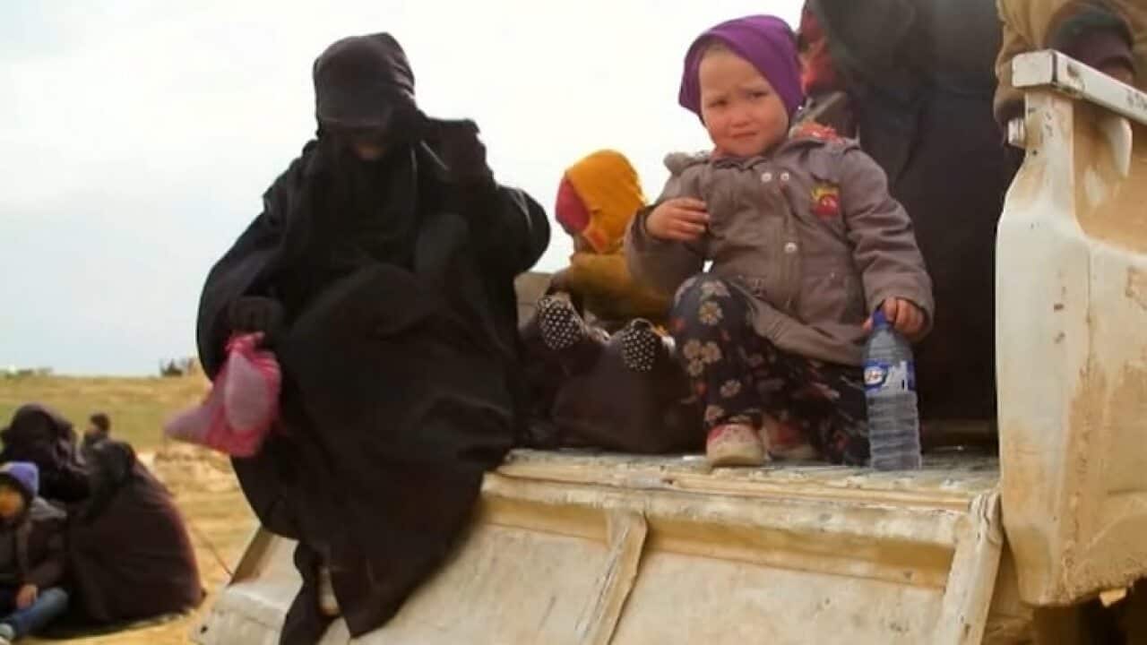 Civilians flee the Syrian town of Baghouz