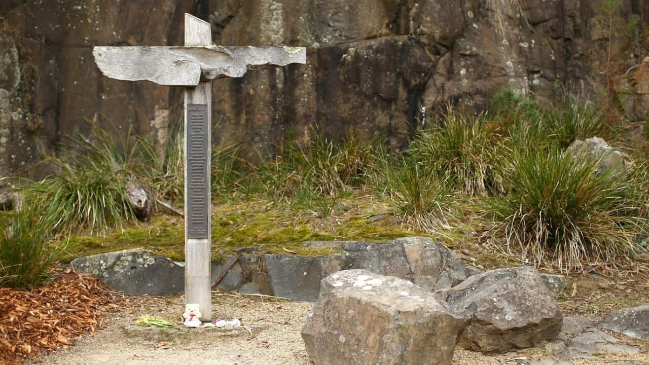 The cross bearing the names of those who lost their lives is seen in the Memorial Garden in the Port Arthur Historical Site