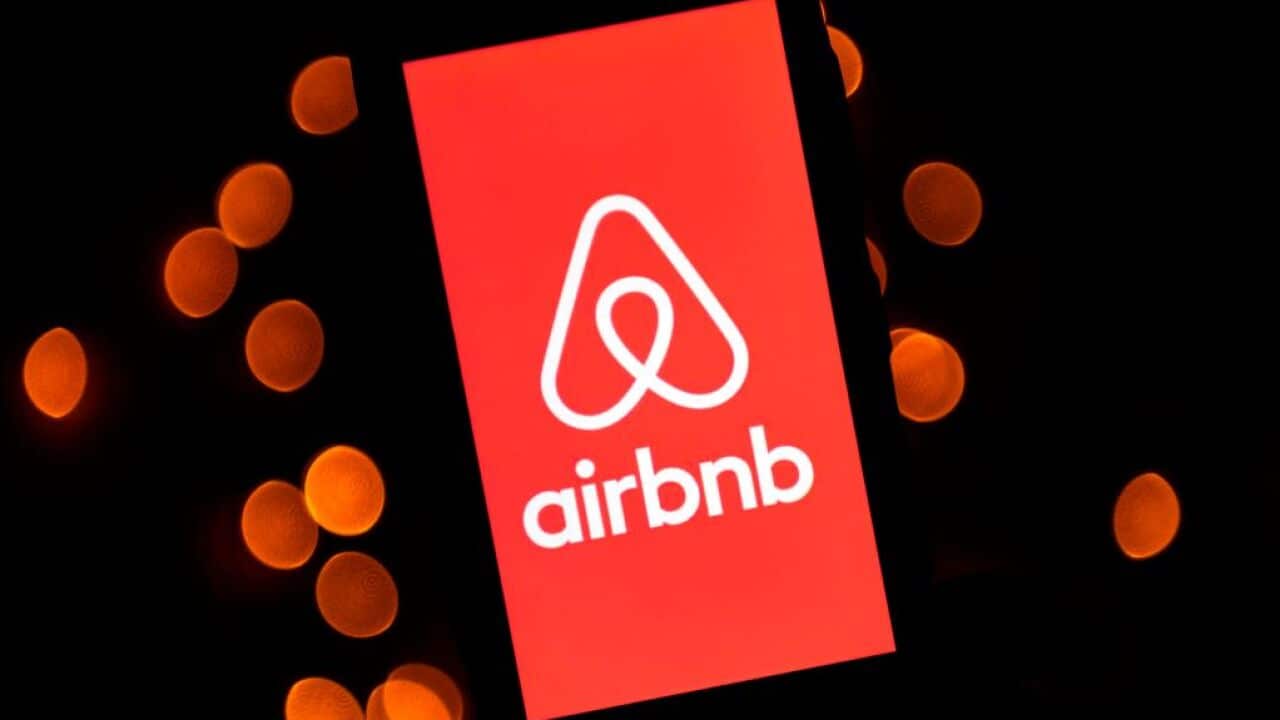 The logo of the online lodging service Airbnb displayed on a mobile phone.