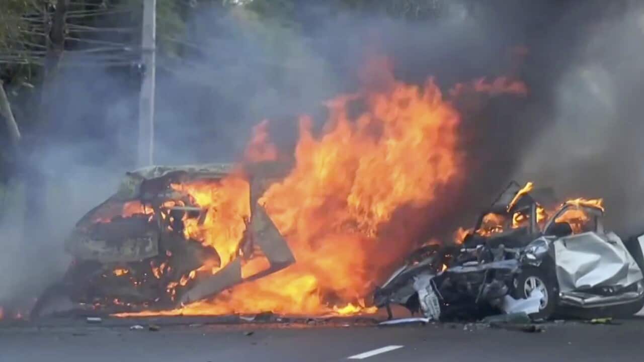 In this image made from video two vehicles burn after they collided on a highway east of Bangkok, Thailand, Monday, Jan. 2, 2017