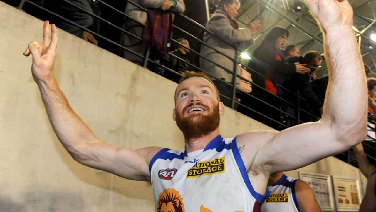 Daniel Merrett of Brisbane celebrates after the team's win