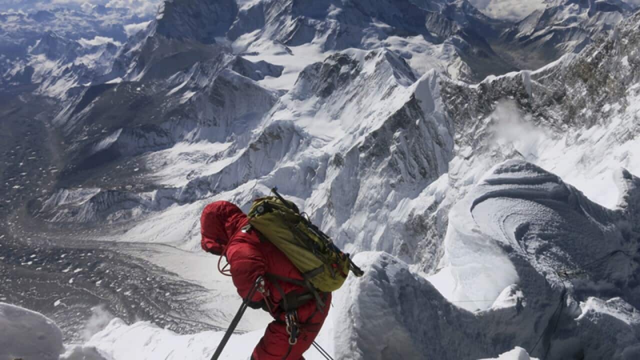 A climber makes his way down from the summit of Mount Everest