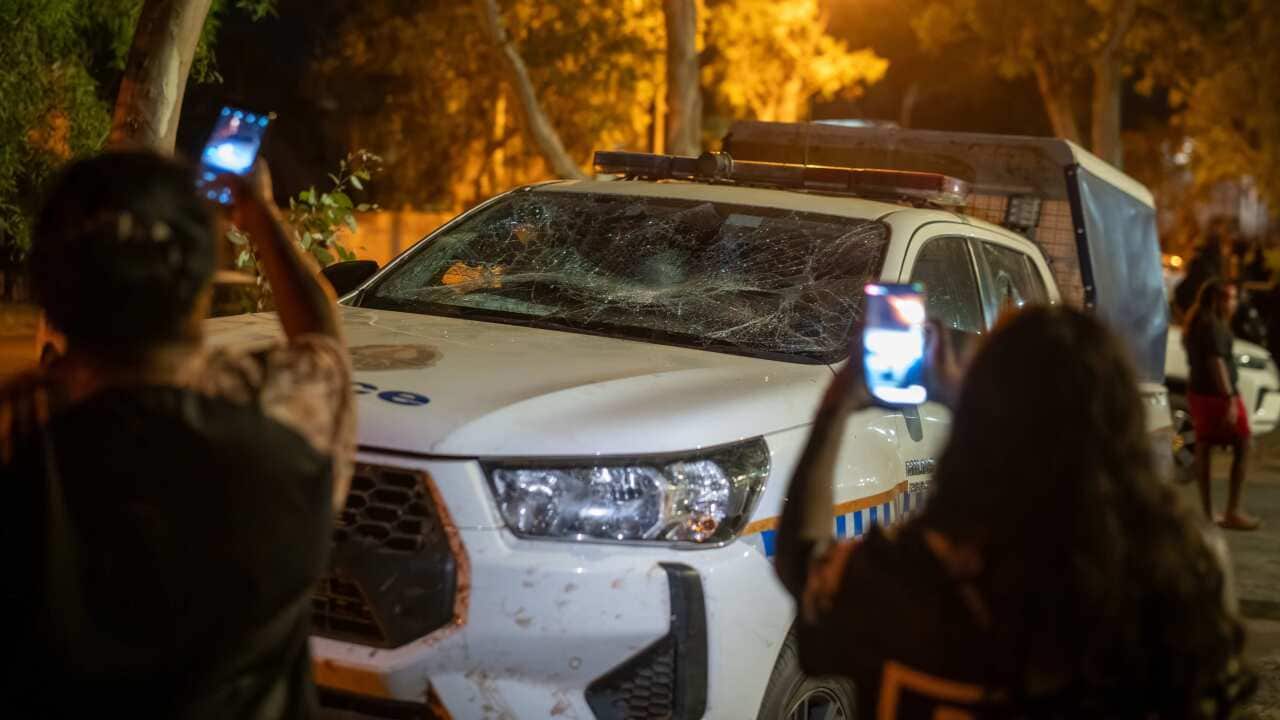 Community members clashed with police outside Alice Springs Hospital, where the alleged suspect was taken after being arrested.