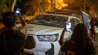Community members clashed with police outside Alice Springs Hospital, where the alleged suspect was taken after being arrested.