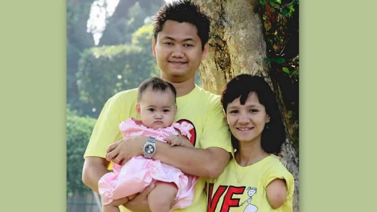 May Zin Aung with her husband and the daughter