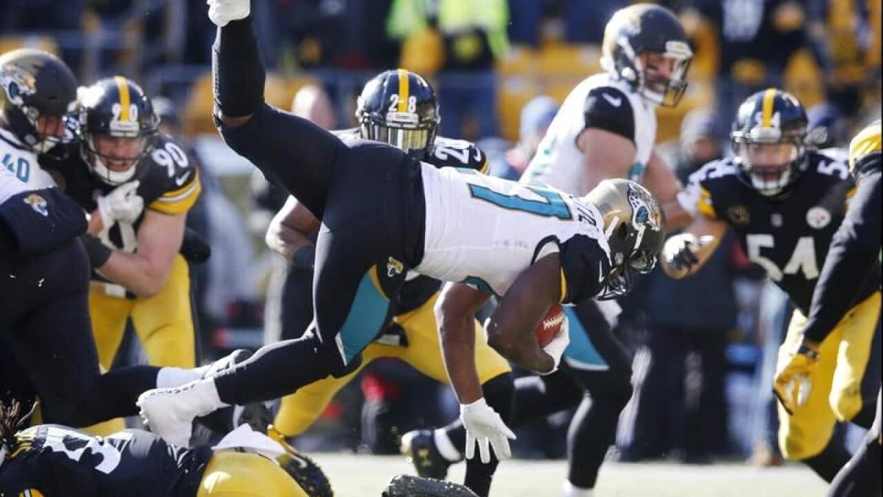 Jacksonville Jaguars running back Leonard Fournette dives in